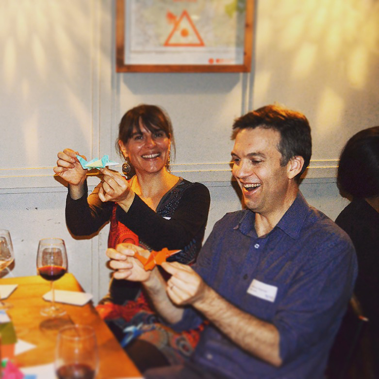 Anthony Hickman - Head of Design at Ulster having fun at NEWH/ United Kingdom evening, learning the art of Origami.