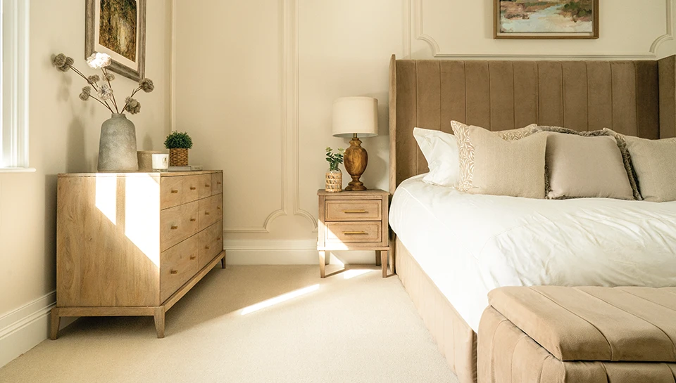 Grange Wilton Vanilla from Ulster Carpets in a bedroom. 