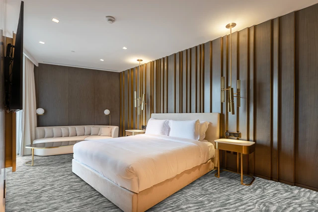 An example of Natura Esker Sif from Ulster Carpets in a modern bedroom setting
