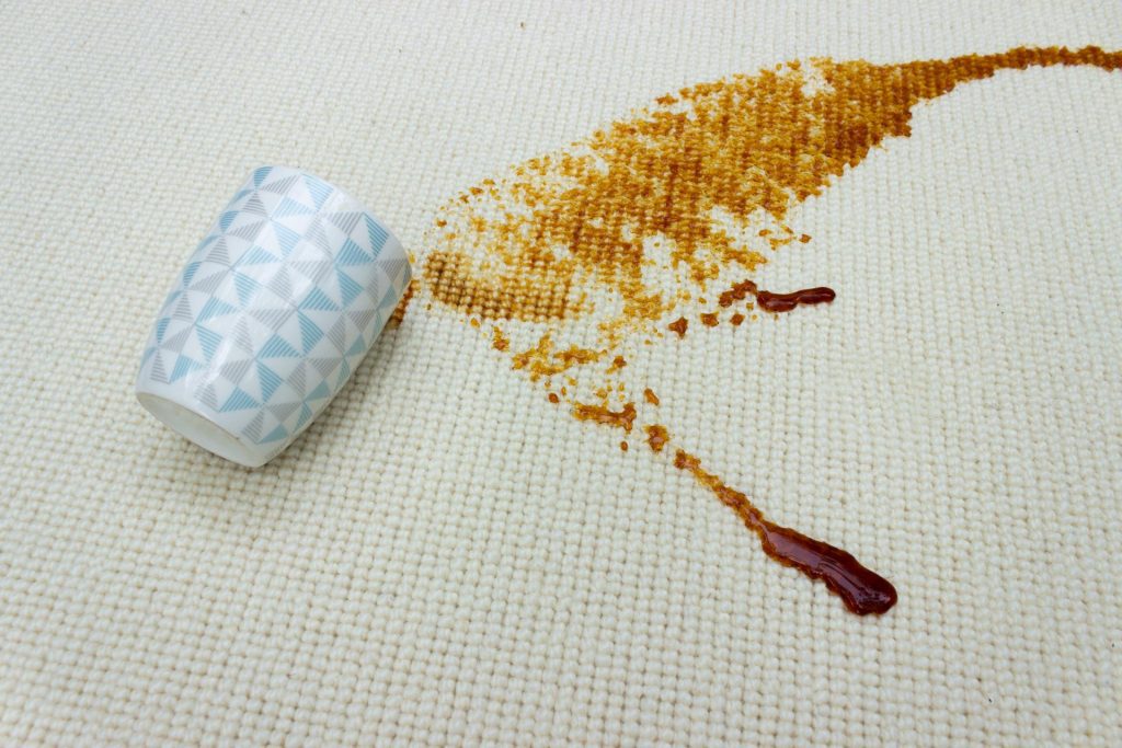 coffee spilling on cream wool carpet